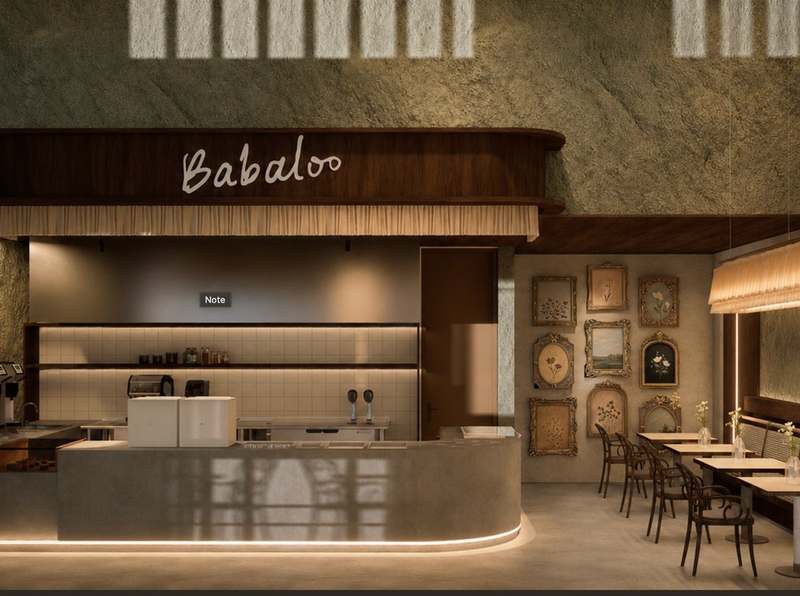 Babaloo bar with the hand-written logo glowing above the counter