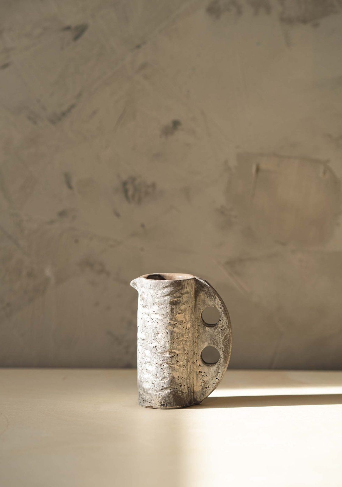 Babaloo to-go cup on a stone table