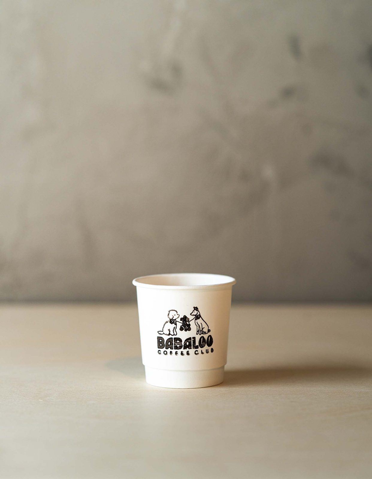 Babaloo to-go cup on a stone counter